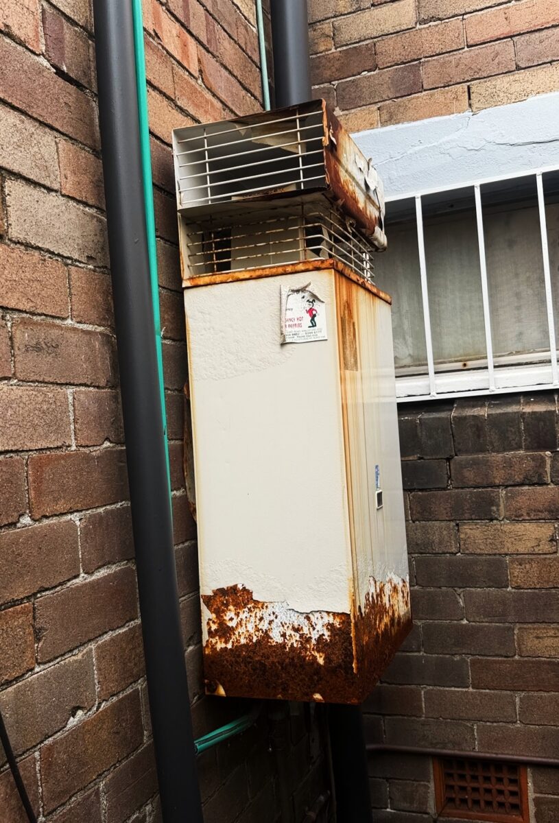Old corroded Bosch external gas continuous flow unit still in service