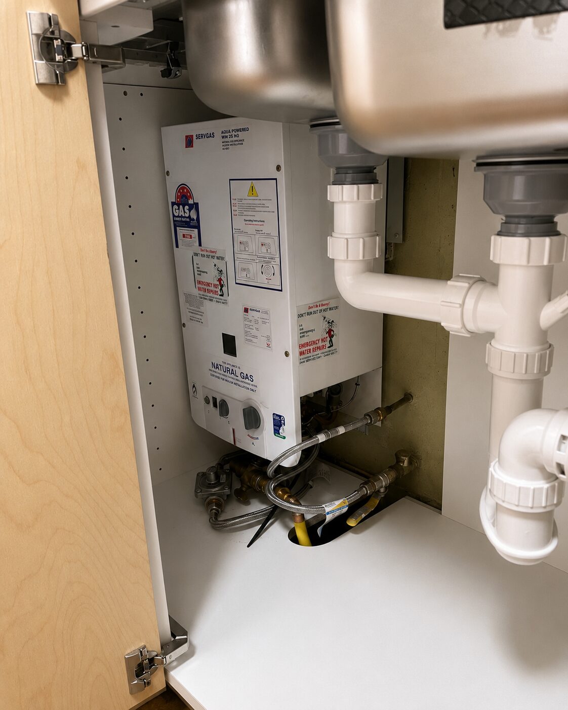Servgas hot water system installed in a kitchen cupboard