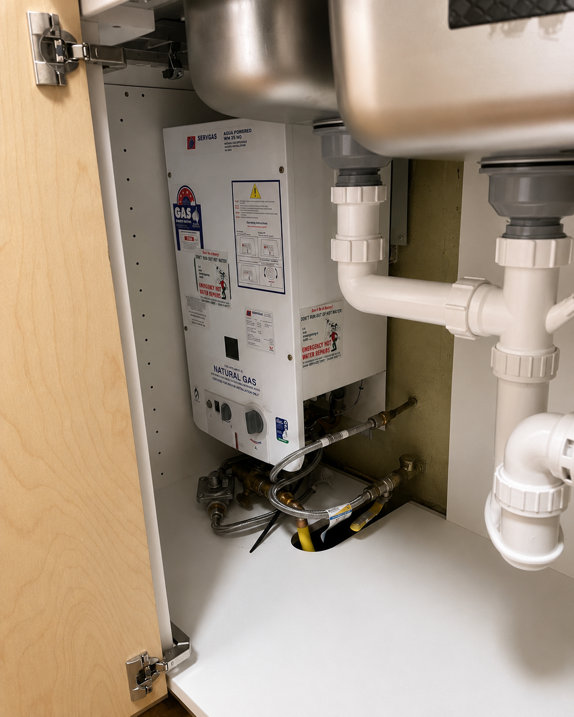 Servgas hot water system installed in a kitchen cupboard