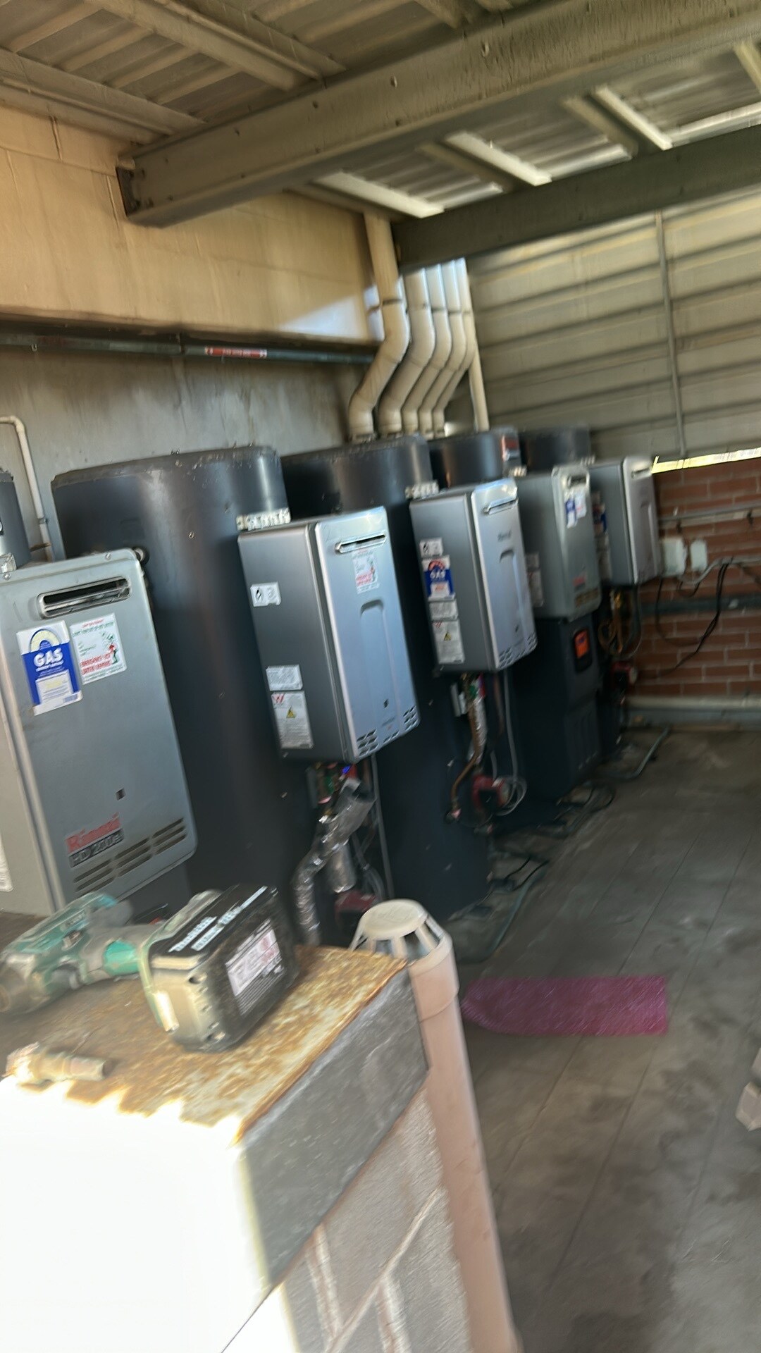 Emergency Hot Water Repairs technician with a new hot water system in Ultimo