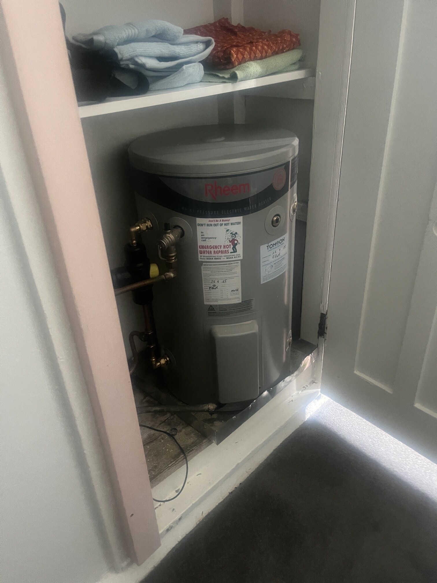 Emergency Hot Water Repairs technician with a new hot water system in The Rocks