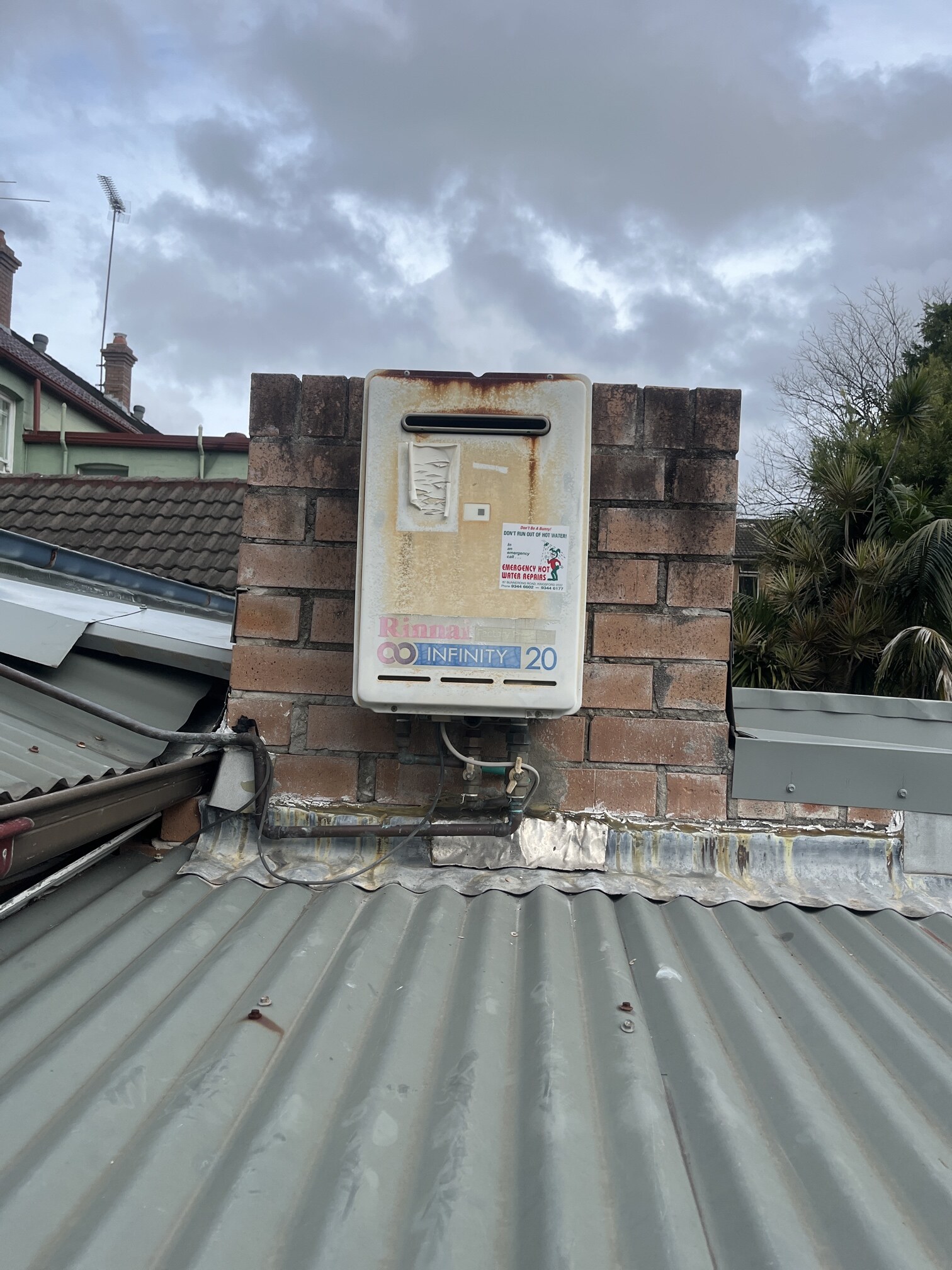 Emergency Hot Water Repairs technician with a new hot water system in Ashbury