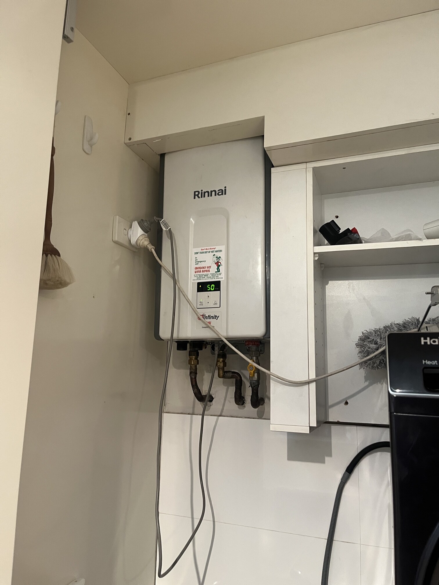 Emergency Hot Water Repairs technician with a new hot water system in Northbridge