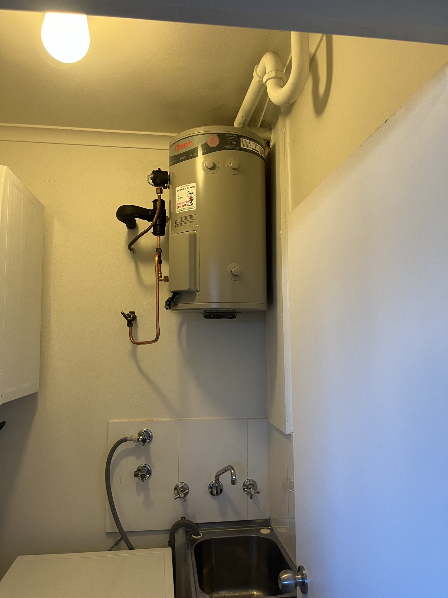 Emergency Hot Water Repairs technician with a new hot water system in Cremorne Point