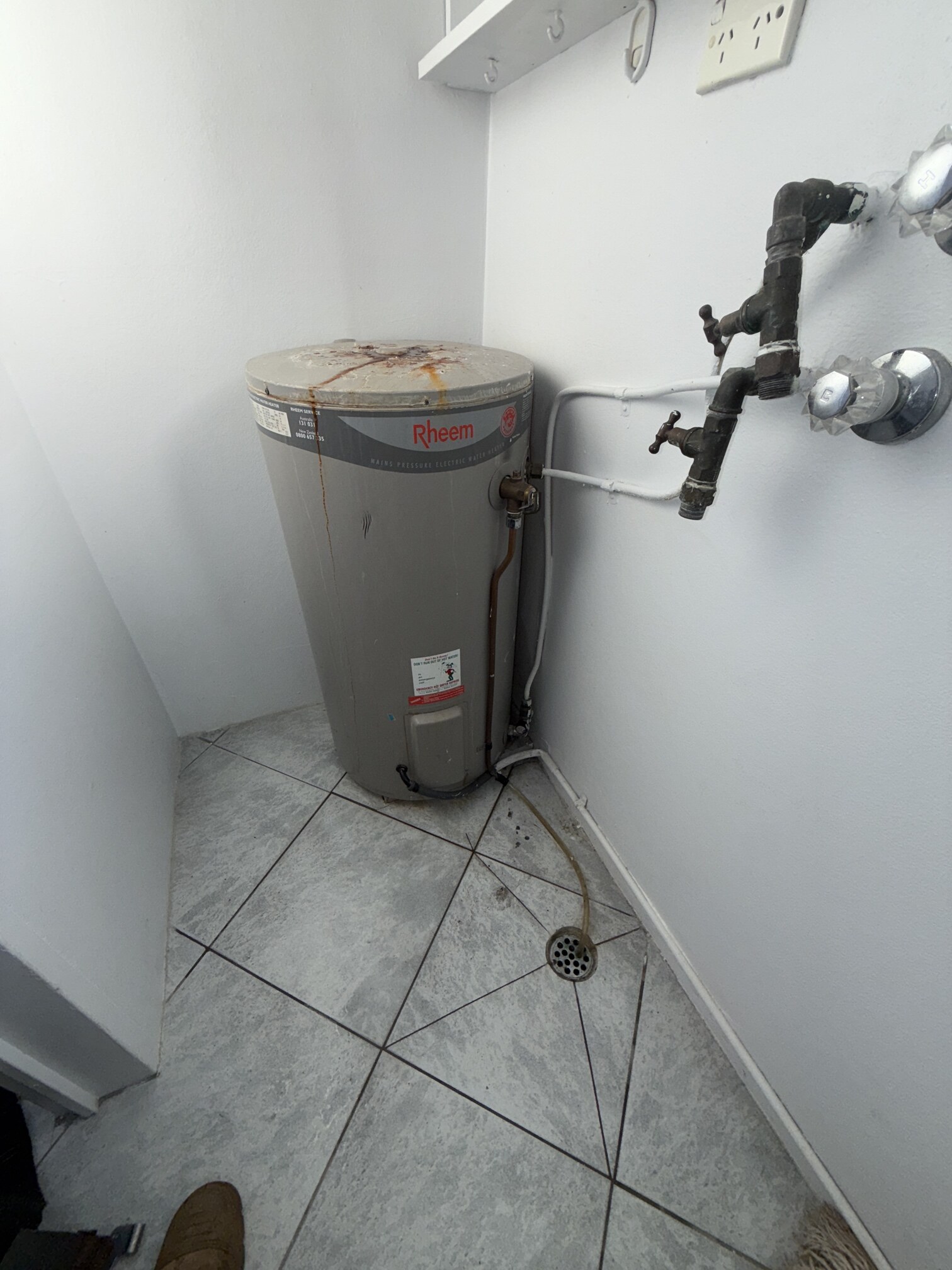 Emergency Hot Water Repairs technician with a new hot water system in Enmore