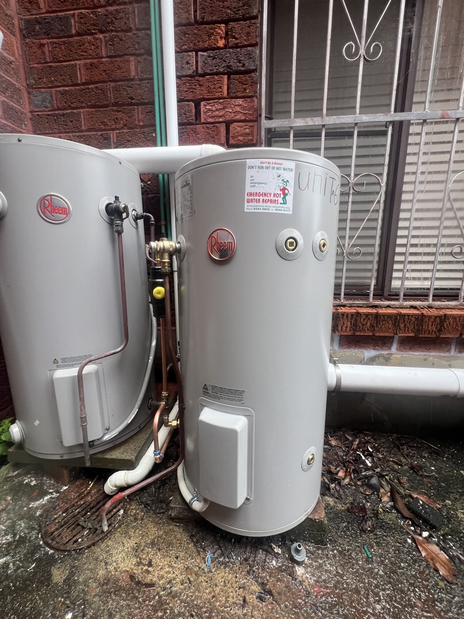 Emergency Hot Water Repairs technician with a new hot water system in Ashfield