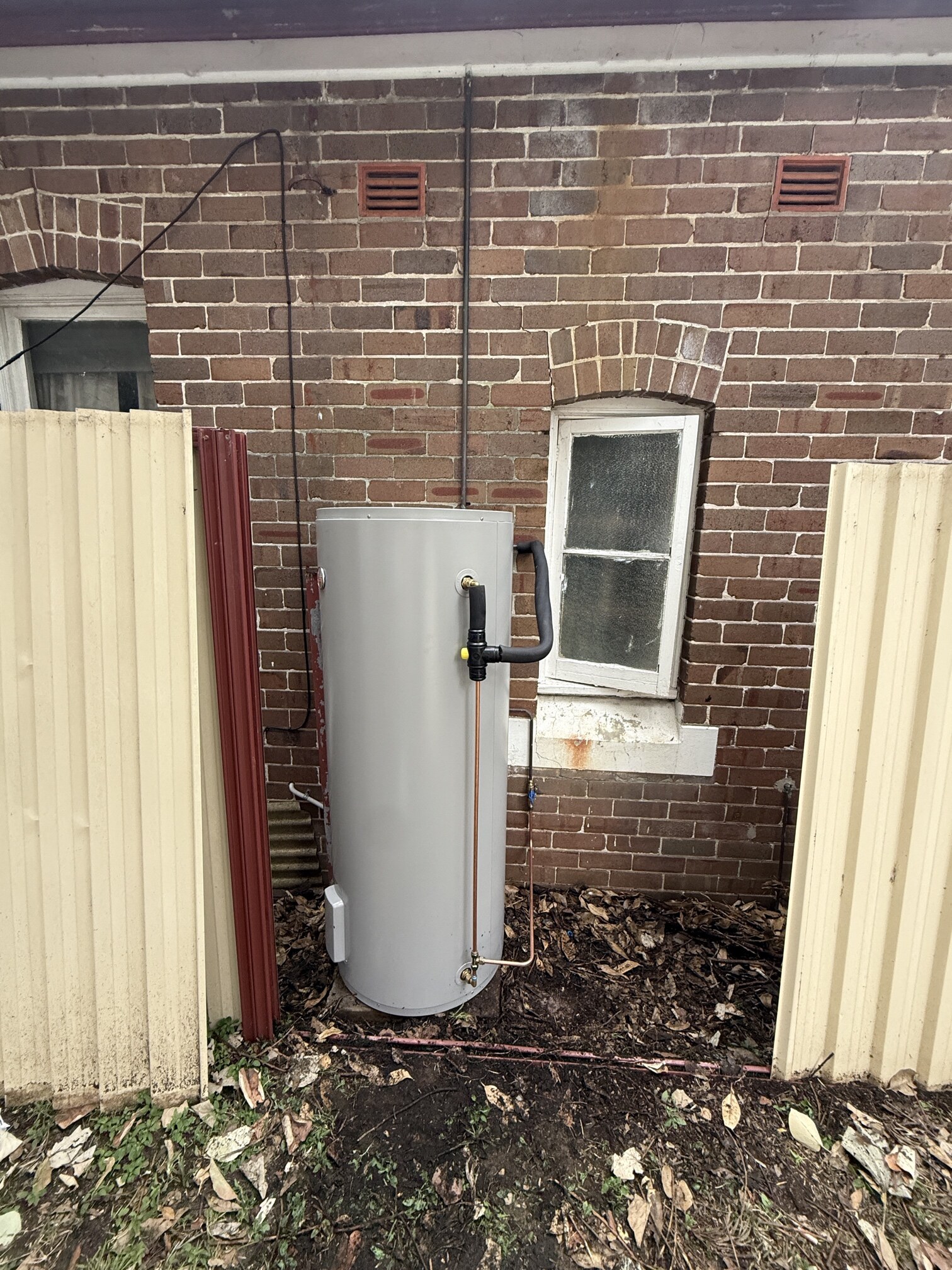 Emergency Hot Water Repairs technician with a new hot water system in Strathfield
