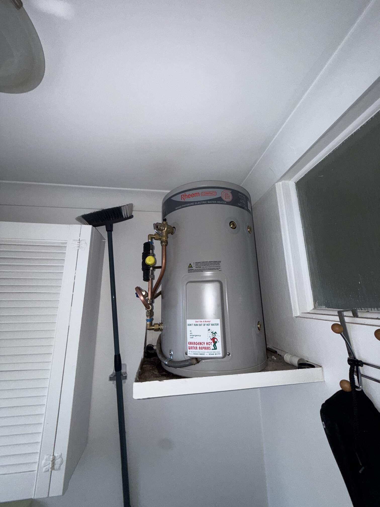 Emergency Hot Water Repairs technician with a new hot water system in Dolls Point