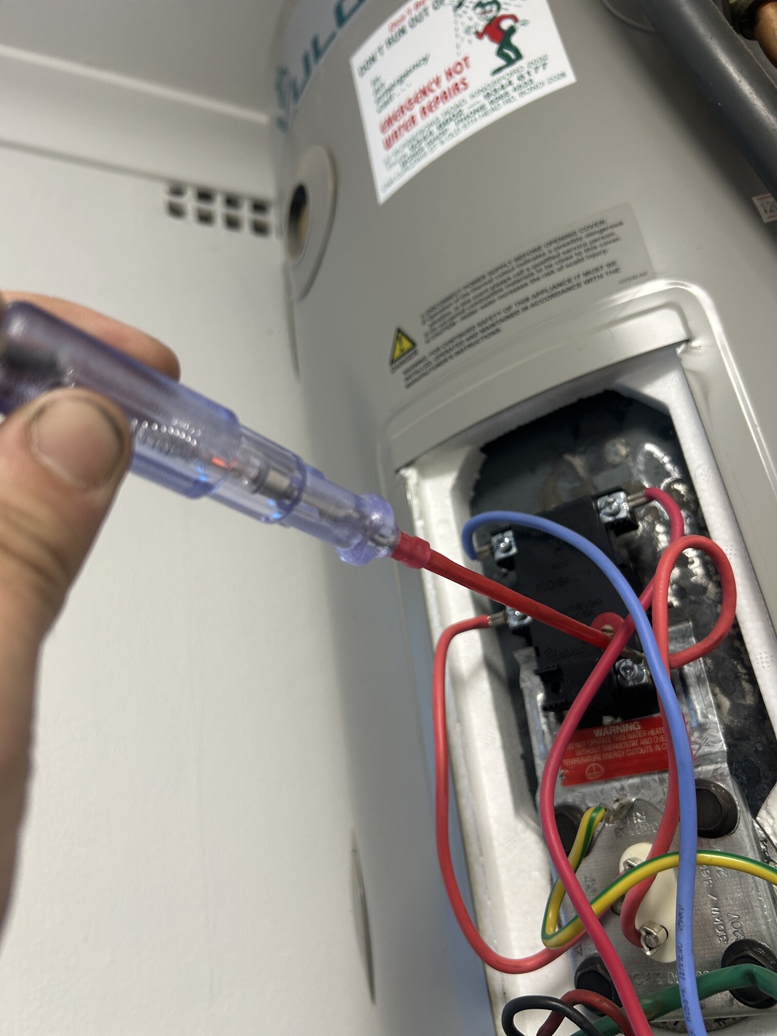 Emergency Hot Water Repairs technician with a new hot water system in Concord