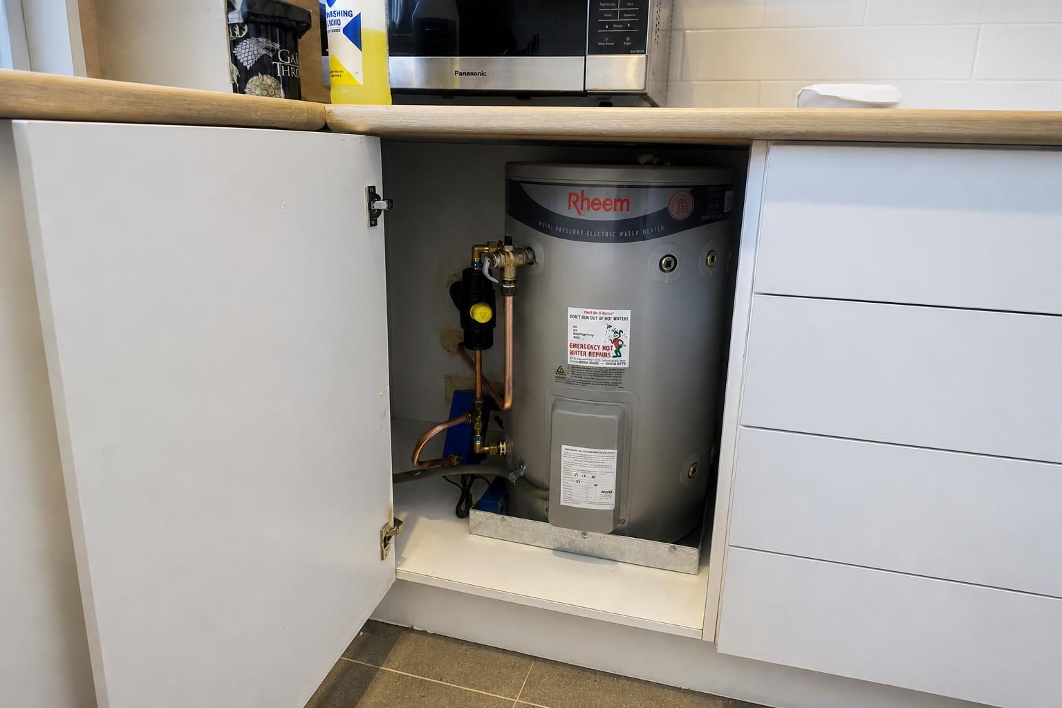 Emergency Hot Water Repairs technician with a new hot water system in Cremorne